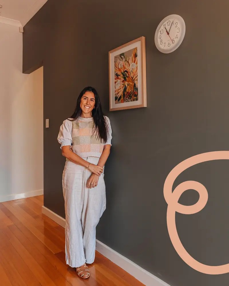 Francisca Lessa Stewart, founder of Connected Minds Psychology, standing in the hallway of the practice in Perth